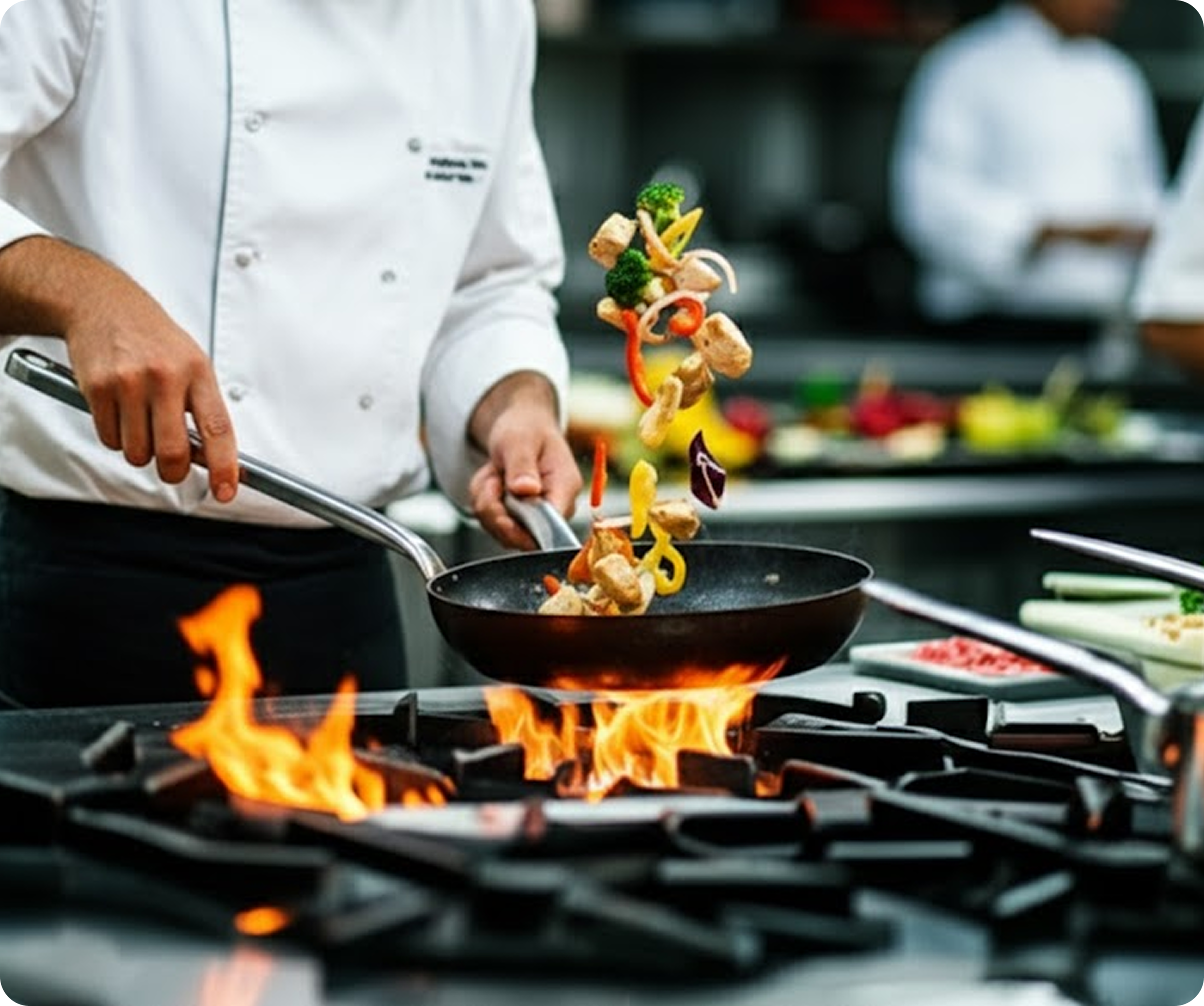 Chef cooking with professional kitchen equipment
